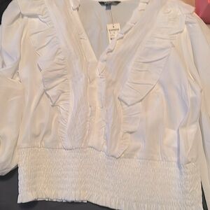I’m selling this brand new white top from Express
